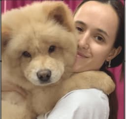 Eva - Professional Dog Grooming Specialist at PawsN'Surf Lisbon, expert in breed-specific styling